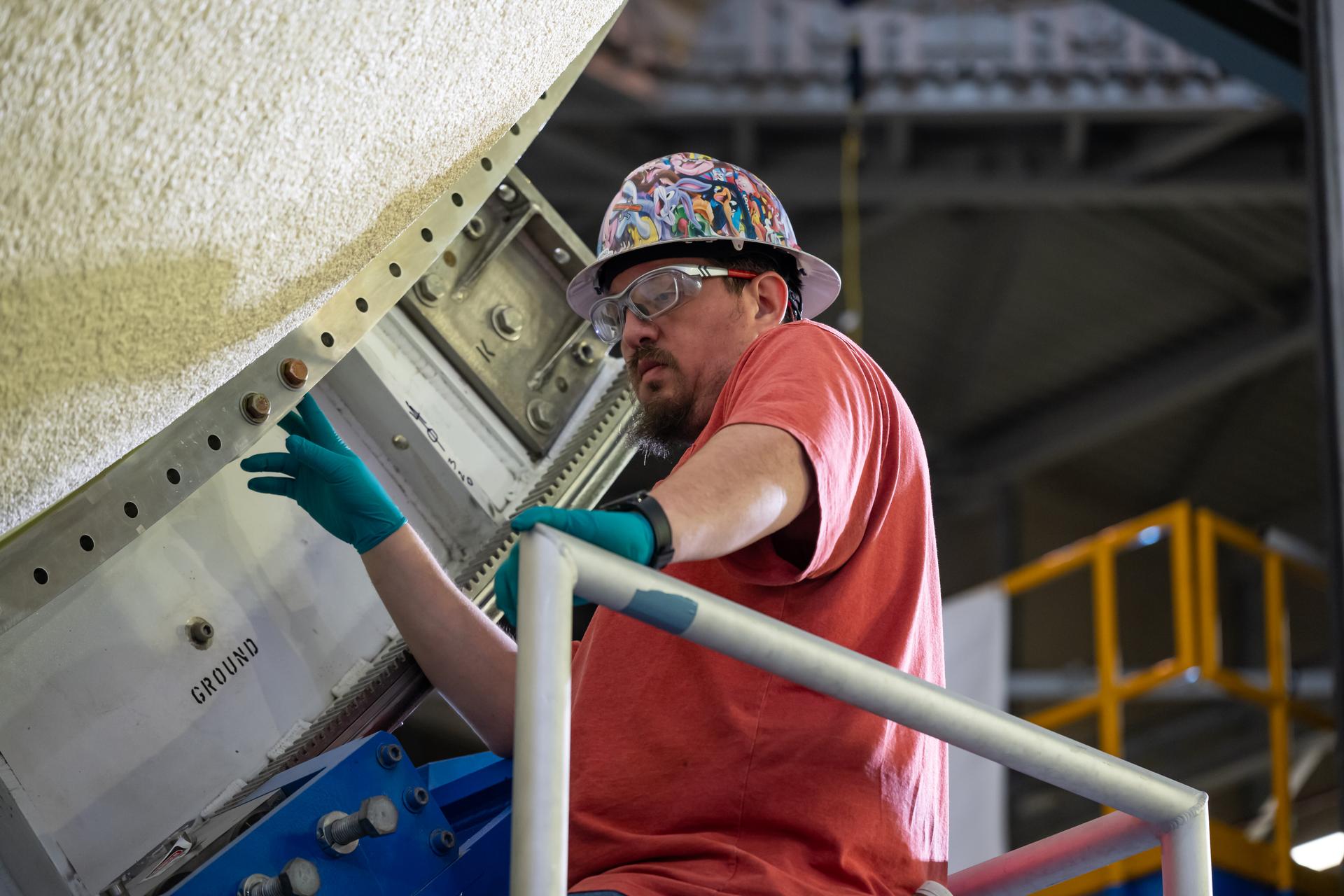 The liquid oxygen tank for NASA’s SLS (Space Launch System) rocket core stage for the Artemis III mission is lifted into a production cell at the agency’s Michoud Assembly Facility in New Orleans on Nov. 7. Move crews use an overhead crane system to lift the tank from the mobile transporter, which carried it from another area of the factory and set it atop the previously loaded intertank. Once the liquid oxygen tank is mated to the intertank, team will mate the stage’s forward skirt atop the tank to complete the forward join.   The propellant tank is one of five major elements that make up the 212-foot-tall rocket stage. The core stage, along with its four RS-25 engines, produce more than two million pounds of thrust to help launch NASA’s Orion spacecraft, astronauts, and supplies beyond Earth’s orbit and to the lunar surface for Artemis.